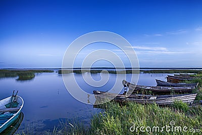 Line of Boats on Water Placed in Belarussian National Park Braslav Lakes Stock Photo