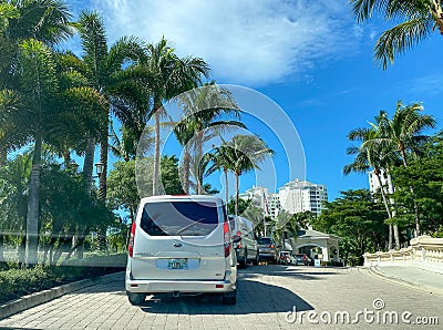 A line of cars waiting to check into the security guard at a luxury condominium in Naples, Florida Editorial Stock Photo