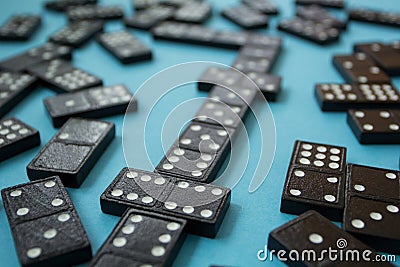 Line of domino pieces on the blue background Stock Photo