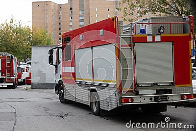 A line of fire engines. Fire in the room. Fire hazard. Failure to comply with fire safety regulations Stock Photo