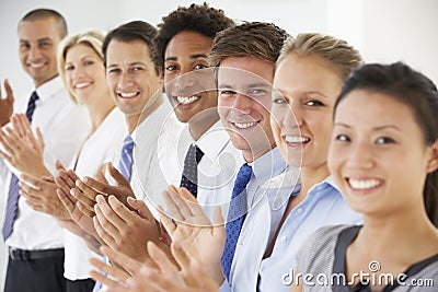 Line Of Happy And Positive Business People Applauding Stock Photo