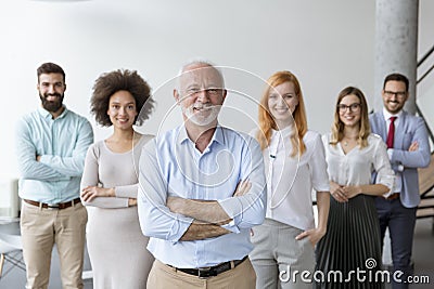 Line of happy and positive business people standing in the office Stock Photo