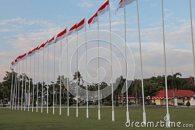 A line of Indonesian flags with the sky as the background. the theme of Indonesia`s independence day. commemoration of heroes day Stock Photo