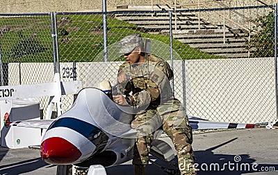 Soldiers give children rides in the aircraft! Editorial Stock Photo