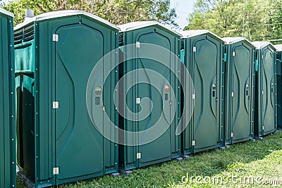 Line of Portable Toilets Stock Photo