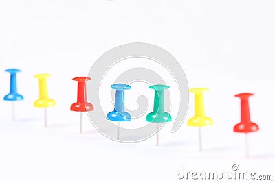 Line of push pins isolated on white background with copy space for your text Stock Photo