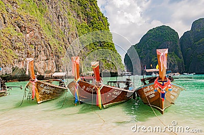 Line of traditional longtail boats docked in the famous Maya ba Editorial Stock Photo