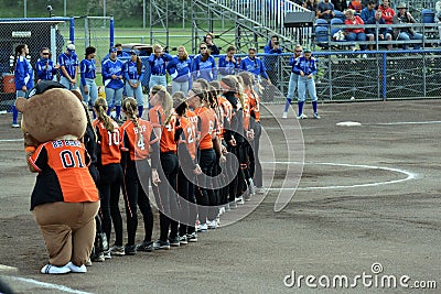 Line up and playing the National anthems prior to the softballgame Editorial Stock Photo