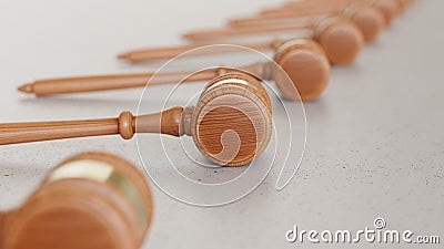 Linear Array of wooden gavels on a Light Gray Surface Stock Photo