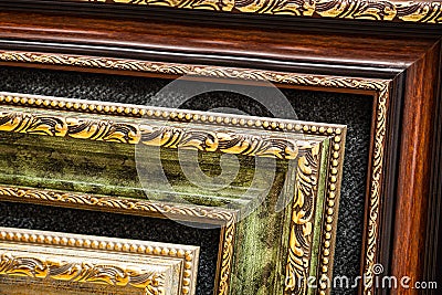Lined up old wooden vintage art frames. Close-up fragment Stock Photo