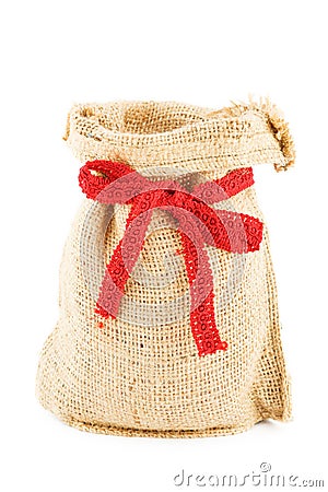 A linen sack empty bandaged by a red ribbon Stock Photo