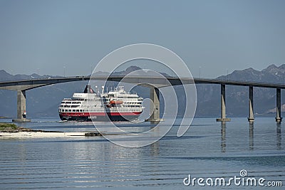 Liner cruising under high bridge near Stokmarknes, Norway Editorial Stock Photo