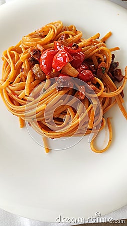 Linguine with cherry tomato and guanciale Stock Photo