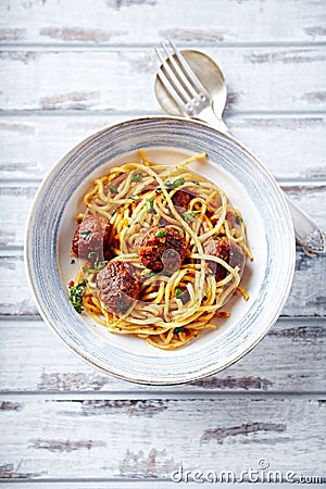 Linguine with meatballs, tomato sauce and parsley Stock Photo