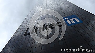 LinkedIn logo on a skyscraper facade reflecting clouds. Editorial 3D rendering Editorial Stock Photo