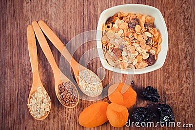 Linseed, rye flakes, oat bran, dried fruits and muesli, concept of healthy nutrition and increase metabolism Stock Photo