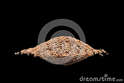 Linseeds. Flax seeds isolated on black background. Flax seed heap isolated on black background. Linseed pile closeup isolated on Stock Photo