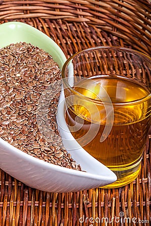 Linseeds (flax seeds) with linseed oil Stock Photo