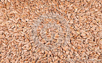 Linseeds. Flax seeds texture background. Flax seed heap background. Linseed pile closeup Stock Photo
