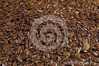 Brown Flax seed. Also known as Linseed, Flaxseed and Common Flax. Closeup of grains, background use Stock Photo