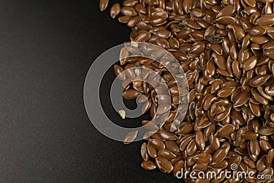 Brown Flax seed. Also known as Linseed, Flaxseed and Common Flax. Closeup of grains, background use Stock Photo