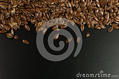 Brown Flax seed. Also known as Linseed, Flaxseed and Common Flax. Closeup of grains, background use Stock Photo