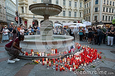flowers and burning candles lie at a memorial in memory of upper austrian doctor Lisa-Maria Kellermayr Editorial Stock Photo