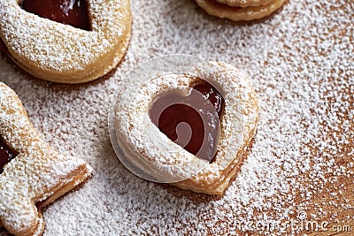 Linzer Christmas cookie in the shape of a heart filled with strawberry jam Stock Photo