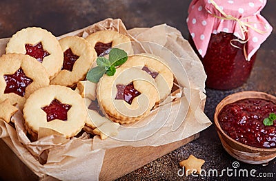 Linzer Christmas cookies with stars. Delicious biscuits with raspberry jam. Stock Photo
