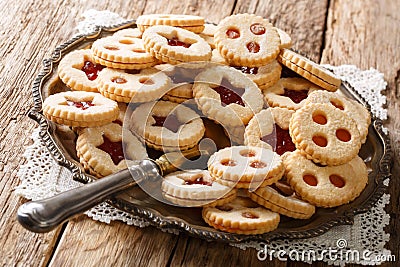 Linzer cookies with jam on a plate. Traditional Austrian biscuits filled. horizontal Stock Photo