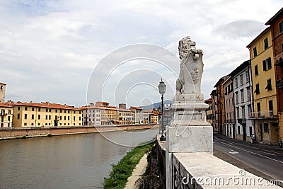 Lion holding a cartouche, stone carved sculpture at the embankment of Arno river, Pisa, Italy Stock Photo