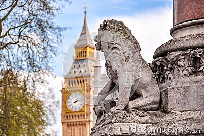 Lion looking at Big Ben clock, London, UK Stock Photo