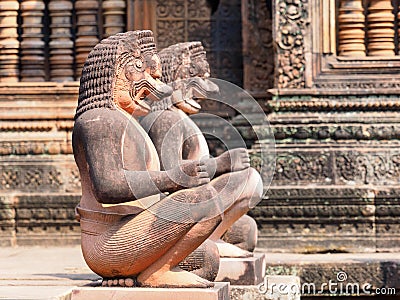 Lion and Monkey Gardians Carvings at Banteay Srei Red Sandstone Temple Stock Photo