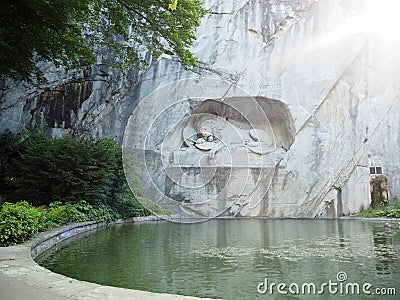 Lion of monument in Lucerne, Switzerland Inscription to commemorate for brave soldiers Stock Photo