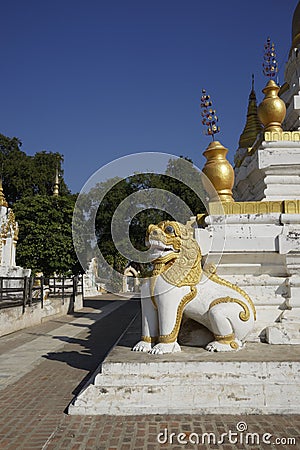 Lion protecting stupas of Maha Aung Mye Bonzan Monastery (Inwa, Myanmar) Stock Photo