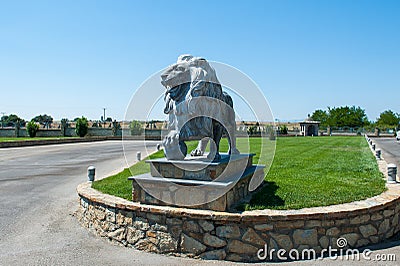 Lion statue, a lone lion on the lawn Stock Photo
