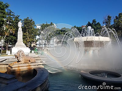 Lion water fountain in Ponce, Puerto Rico with rainbow Stock Photo