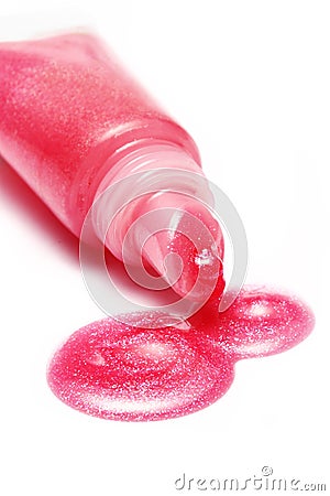 Lip gloss pink color from tube on white background Stock Photo