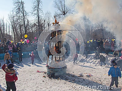 Lipetsk, Russia - March 10, 2019: Burning effigy. Holiday Maslenitsa. People see off the winter Editorial Stock Photo