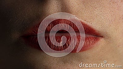 Lips of the girl are badly made up by lipstick Stock Photo