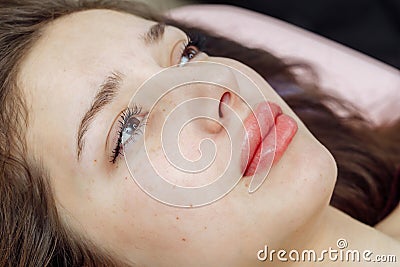 Lips after permanent makeup in beauty salon Stock Photo