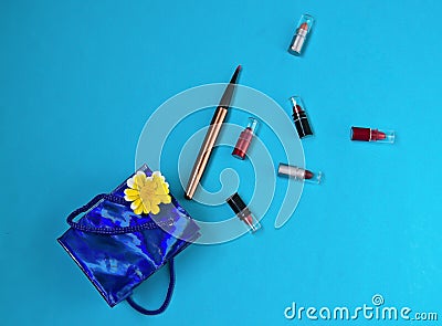 Lipstick, brush, package, gift, surprise,on blue background Stock Photo