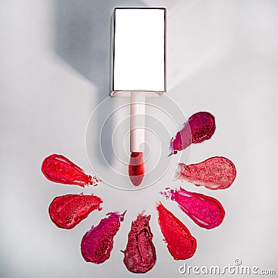 Lipstick gloss swatch with aplicator on marble Stock Photo