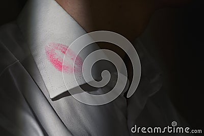 Lipstick marks on the collar of a men`s white shirt Stock Photo