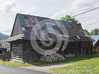 Liptovska luzna, Low Tatras, Slovakia, August 30, 2020: Old shabby log cabin cottage, timbered rural house with rusty Editorial Stock Photo