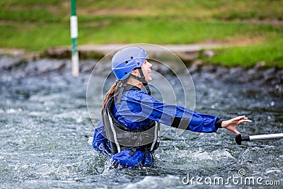 Liptovsky Mikulas / Slovakia - June 22, 2019: young girl with life jacket in water at rafting training center Editorial Stock Photo