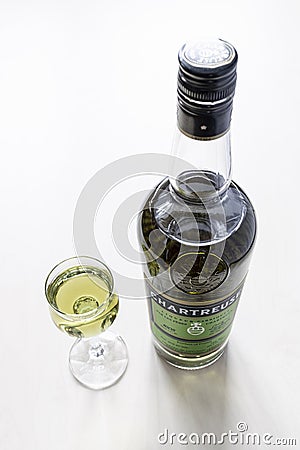 Liqueur glass and bottle of Chartreuse liqueur Editorial Stock Photo