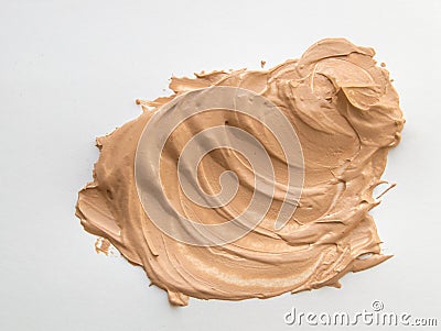 Liquid beige Foundation smeared on a white background Stock Photo