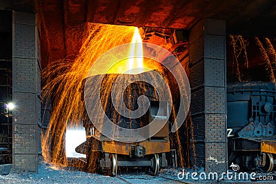 Liquid iron from ladle in the factory Stock Photo