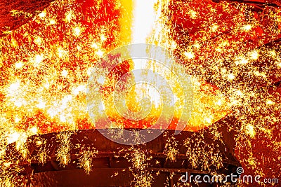 Liquid iron from ladle Stock Photo